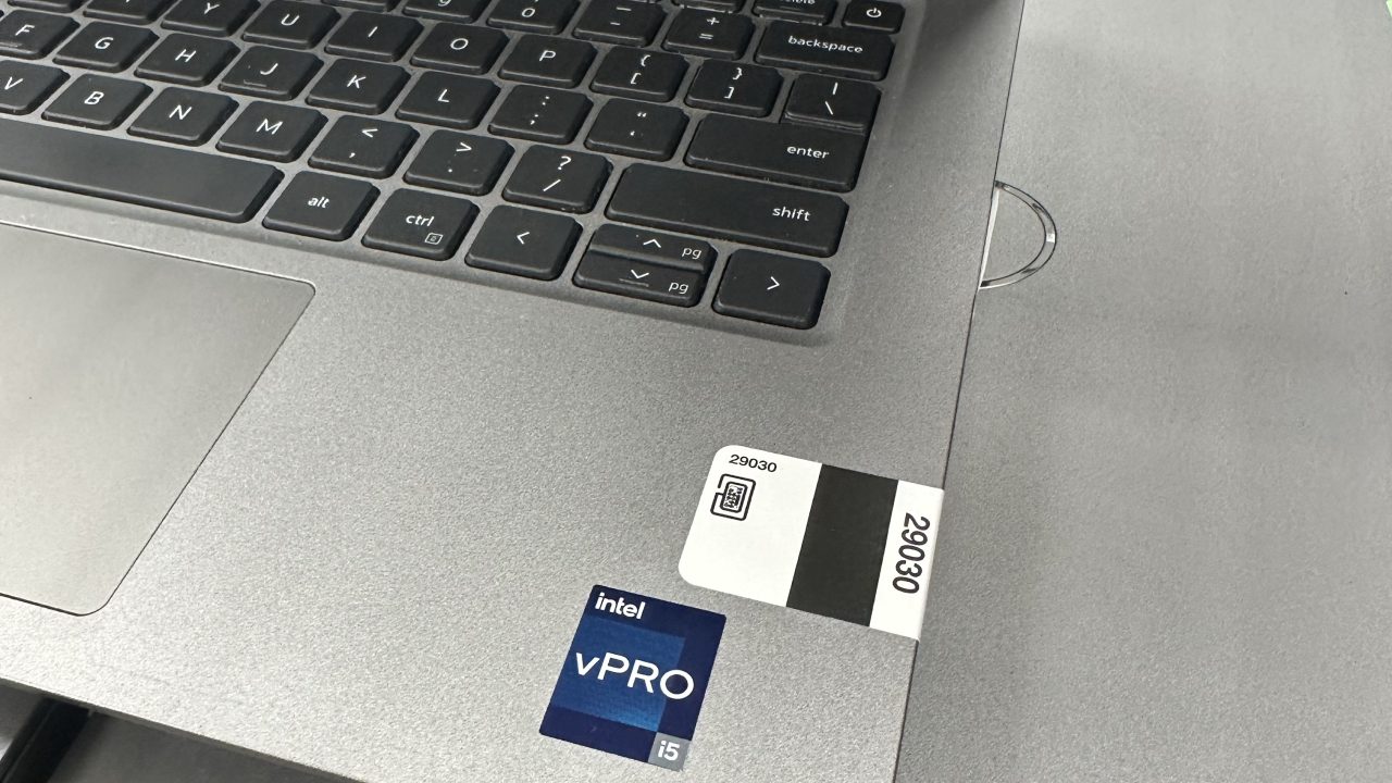 Gray laptop open with label number visible