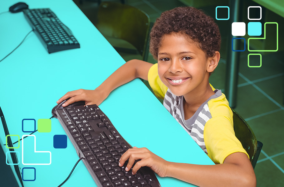 A boy working on a desktop computer