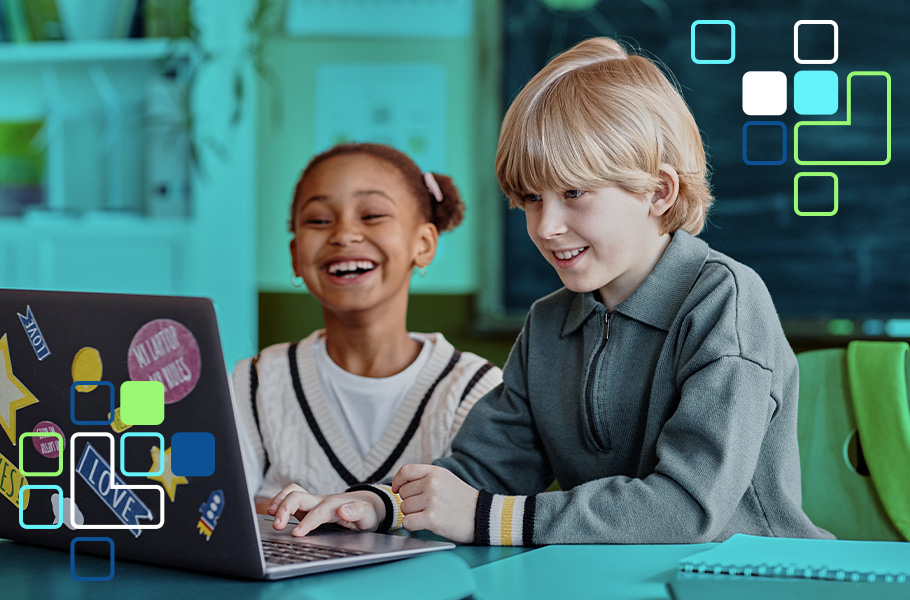 A girl and boy working on a laptop computer